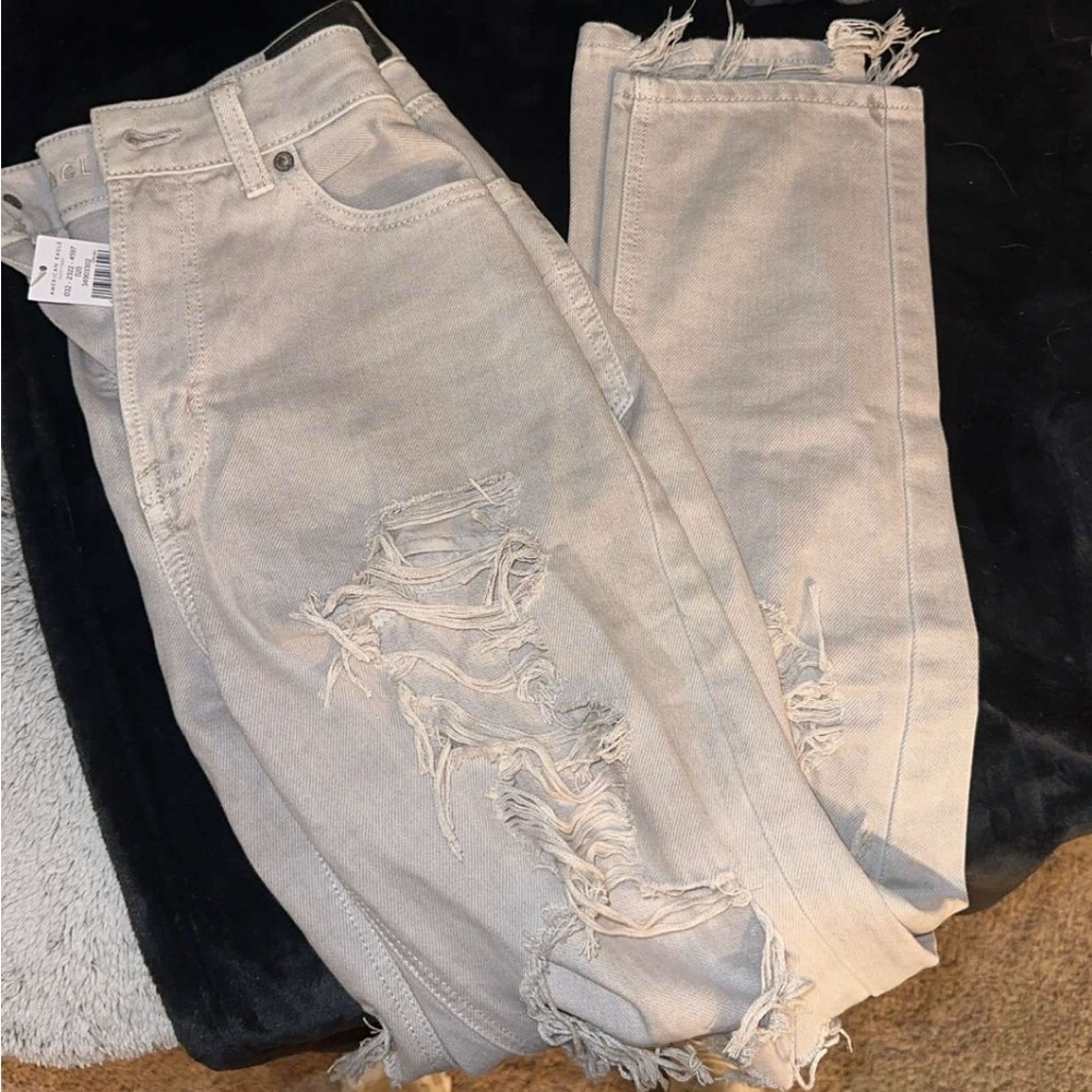 Tan American Eagle distressed jeans